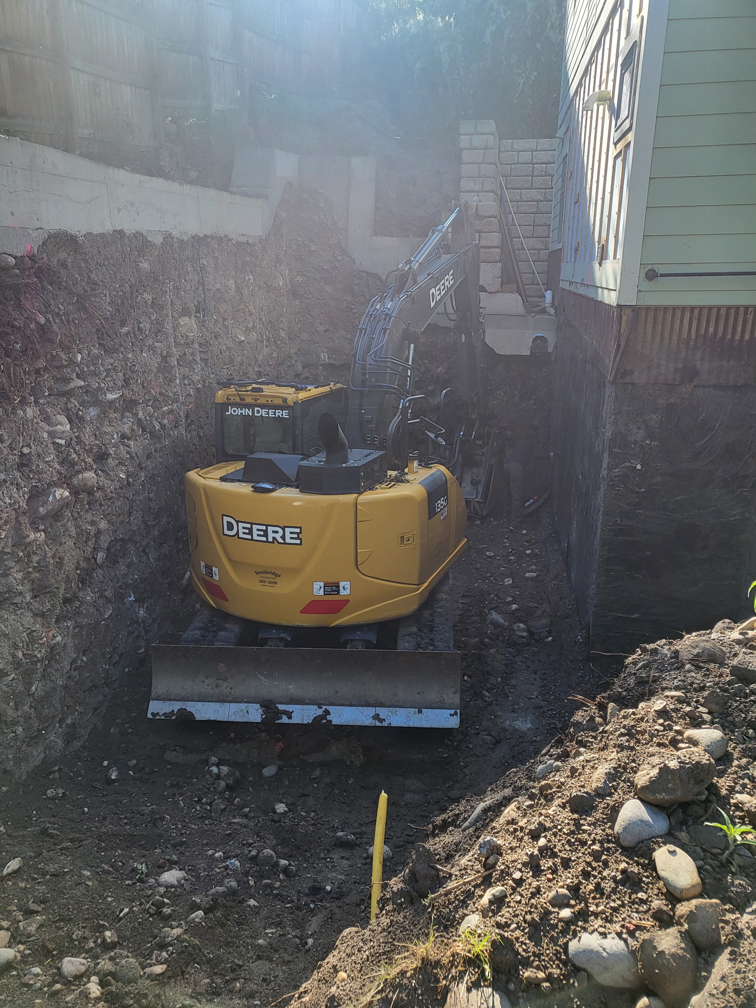 135G excavator at work on a job site